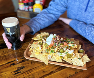 Load nachos and Guiness pint. 