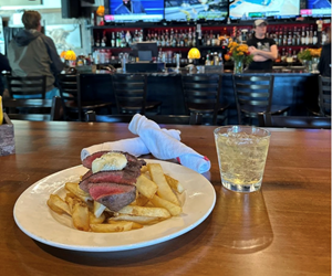 Enoy a steak and fries while watching your favorite team. 